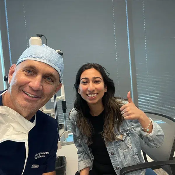 Happy patient Taryn Smithson with her surgeon after a successful laser eye surgery at Holzman Laser Vision